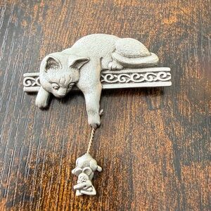 Vintage JJ brooch featuring a cat and mouse